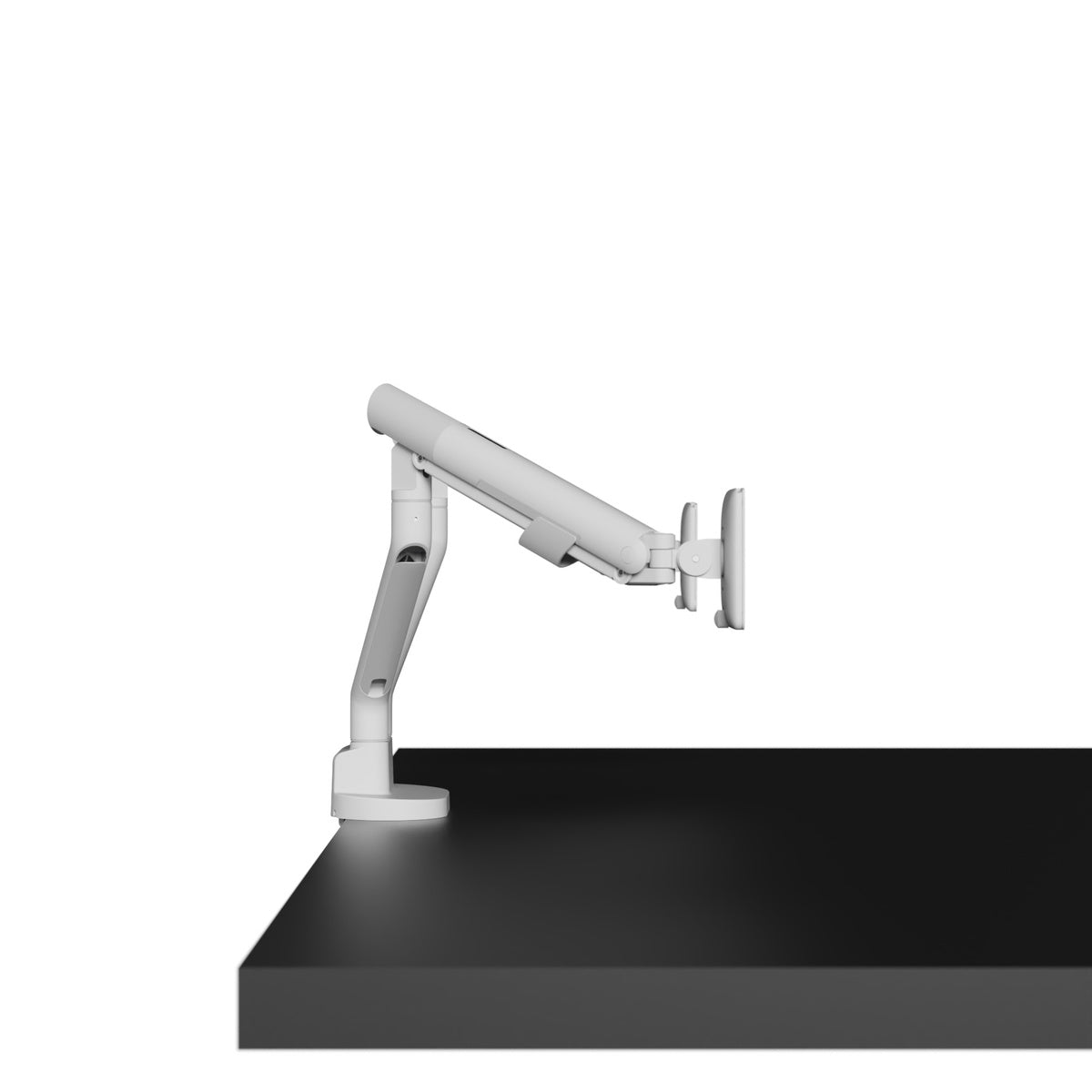 White adjustable monitor arm on a black desk with a white background