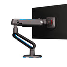 Monitor arm attached to a black monitor on a white background