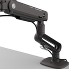 Black adjustable monitor stand on a white background
