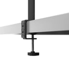 Close-up of a metal clamp holding two horizontal metal bars on a white background