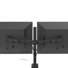 Black dual monitor stand with two monitors on a white background