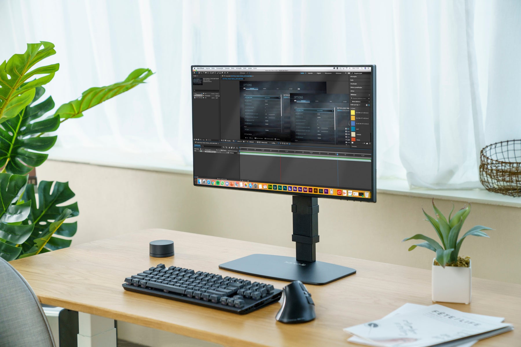 Modern office desk setup with a computer monitor, keyboard, and mouse.
