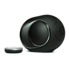 Devialet Phantom Ultimate 98 dB High-End Connected Speaker - Deep Forest - facing right with remote to left