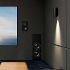 Lyngdorf DW-10 Passive Shallow In-Wall Dual 10" Woofer lifestyle shot of unit in wall to right of theater screen