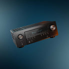 Denon AVR-S980H AV Receiver front view angled right and tilted left on dark background