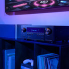 Denon AVR-S980H AV Receiver lifestyle photo of unit on cabinet set to Video Game mode