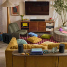 Sonos Beam Ultra Soundbar - lifestyle photo of black soundbar on a cabinet in a living room
