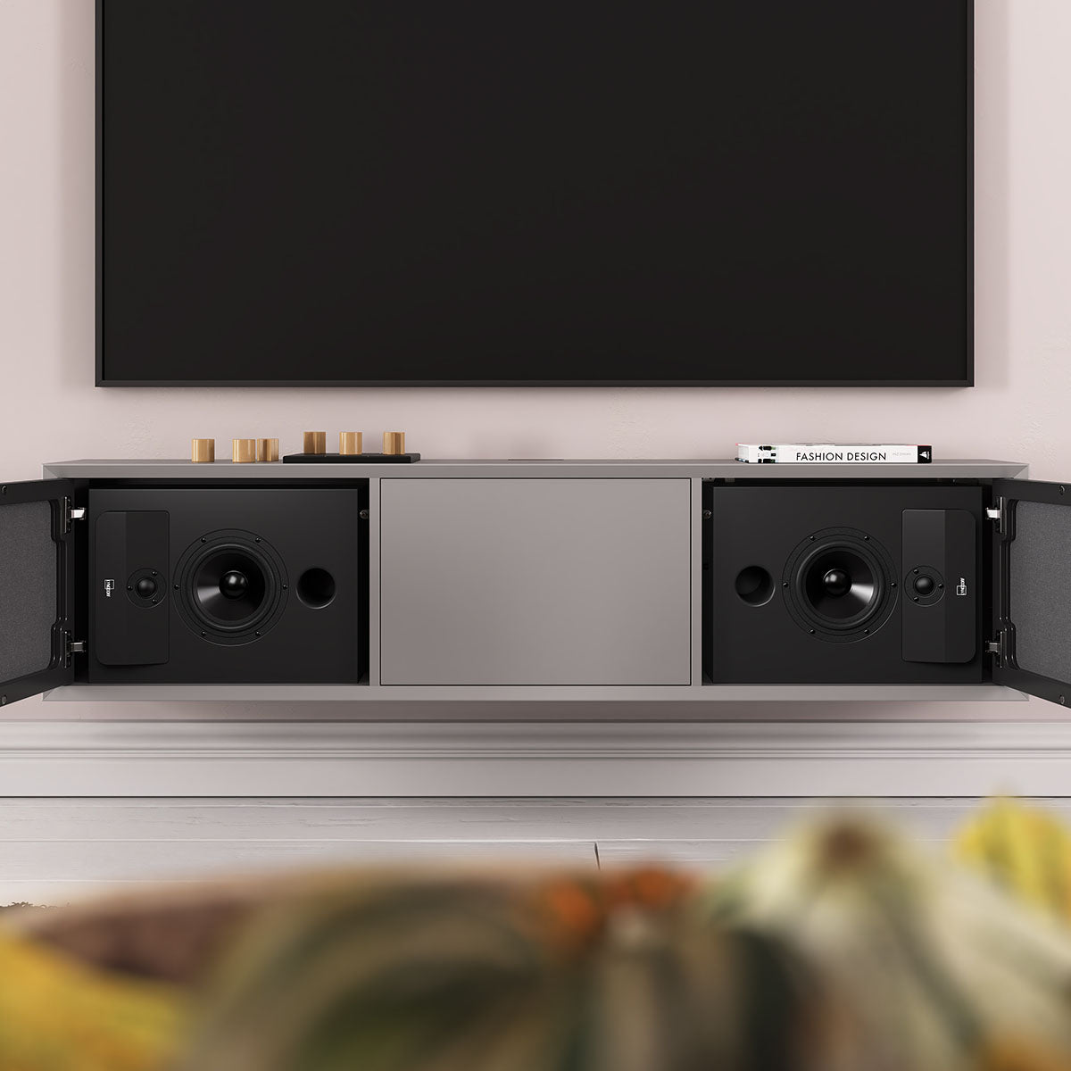 Lyngdorf CS-2 Speaker lifestyle shot front view of two units in cabinet below TV