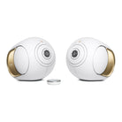 Devialet Phantom Ultimate 108 dB High-End Connected Speaker - Opera de Paris - two speakers facing inward with remote center left