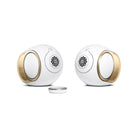 Devialet Phantom Ultimate 98 dB High-End Connected Speaker - Opera de Paris - pair of speakers facing inward with remote center left