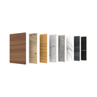 A row of vertical material swatches showing different surface finishes and patterns, including wood grain in brown and tan tones, concrete, white marble, and dark charcoal/black options, on a plain white background.