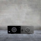 Lyngdorf TDAI-1120 Compact Streaming Amplifier with RoomPerfect front view on a gray background