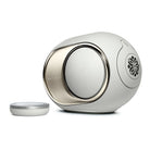 Devialet Phantom Ultimate 98 dB High-End Connected Speaker - Light Pearl - facing right with remote to left