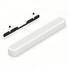Sonos Beam Ultra Soundbar - white - front and top view angled right with separately-sold wall mount behind unit