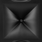 Close-up of a black speaker cone with a central driver