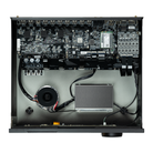 Back panel of a high-end audio equipment with various connectors on a white background