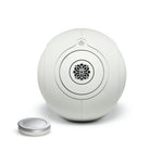 Devialet Phantom Ultimate 108 dB High-End Connected Speaker - Light Pearl - front view with remote to left