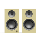 Pair of gloss yellow Kanto TUK Gen 2 260W Premium Powered Speaker System with black grilles on a white background