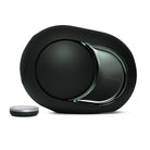 Devialet Phantom Ultimate 108 dB High-End Connected Speaker - Deep Forest - facing left with remote to left