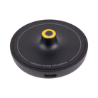 A circular black precision tuning microphone with a central yellow ring accent and a USB-C port on the side, shown on a plain white background.