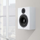 Lyngdorf MH-2 Satellite Speaker lifestyle shot white speaker without grille mounted on wall