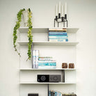Lyngdorf TDAI-1120 Compact Streaming Amplifier with RoomPerfect lifestyle shot of unit on shelf