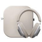 Over-ear wireless headphones in a warm light beige/taupe color, shown in front of a matching rectangular carrying case on a plain white background.