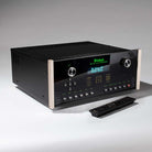 McIntosh MX124 A/V Processor front view angled left with remote in front of unit