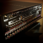 Close-up of the rear panel of a Marantz Cinema 50 Series 2 AV Receiver, showing various input and output jacks, volume knobs, and branding.