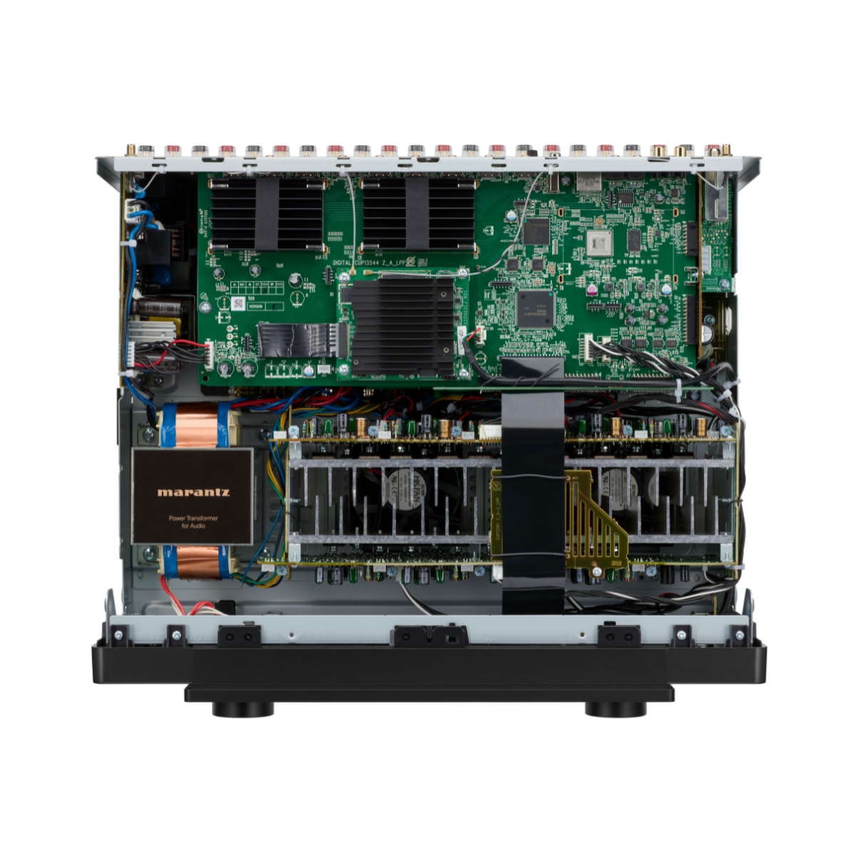 An open electronics chassis showing internal components, including a large green circuit board, heat sinks, capacitors, and a Marantz power supply module, isolated on a white background.