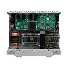 An open-front electronic amplifier or audio power supply chassis showing internal components including a large green circuit board, heat sinks, transformers, and a black Marantz brand label on a red coil, photographed on a white background.