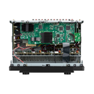 An open electronic control module or amplifier chassis showing internal green circuit boards, black heat sinks, wiring, and a silver metal base on a white background.