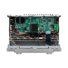 An open silver metal electronic amplifier or audio receiver chassis showing the internal green circuit boards, heat sinks, and wiring against a white background.