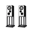 Two black and white Mission 700 Bookshelf Speaker on black metal stands, shown against a plain white background.