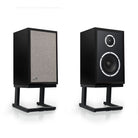 KLH Model Three Acoustic Suspension Loudspeakers - pair of black speakers both angled right, left speaker with grille, right speaker without grille