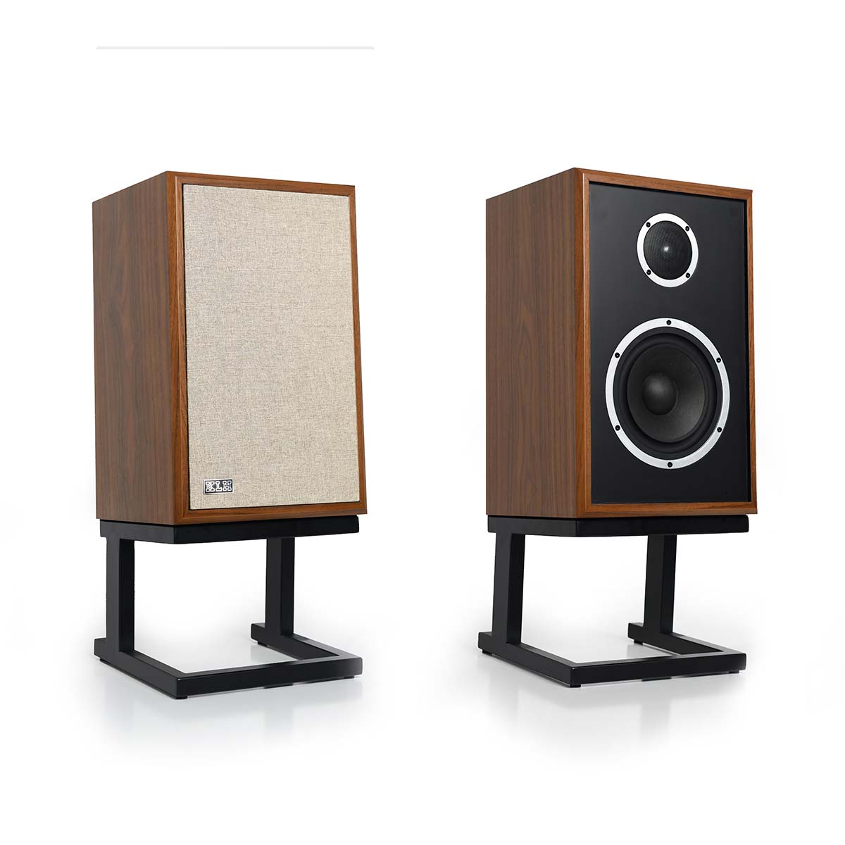 KLH Model Three Acoustic Suspension Loudspeakers - pair of walnut speakers both angled right, left speaker with grille, right speaker without grille