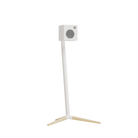 A modern white floor speaker on a Monitor Audio Radius Floor Stand 4G with light natural wood tripod legs, shown against a solid white background.