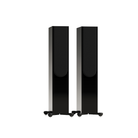 A pair of tall, slim black floorstanding speakers with a glossy finish and small feet, shown against a plain white background.
