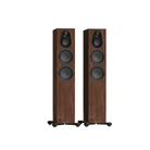 Two tall Monitor Audio Silver 300 8G 3-Way Floor Standing Speakers with a dark brown wood grain finish and black drivers, shown side-by-side on a plain white background.