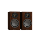 A pair of Monitor Audio Silver 50 8G Compact 2-way Bookshelf Speaker with dark brown wood-grain cabinets, black midranges, and gold-tipped top drivers, shown against a plain white background.