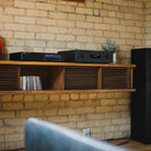NAD C 589 CD Player - lifestyle photo front view of unit on cabinet