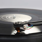 Rega ND9 Moving Magnet Phono Cartridge - side and top view of cartridge mounted on tone arm with needle on record