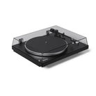 Black turntable with clear dust cover on a white background