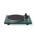 Green turntable with black platter on a white background