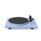 Blue turntable with black platter on a white background
