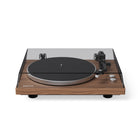 Wooden turntable with black platter on a white background