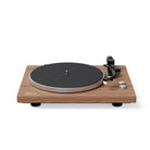 Wooden turntable with black platter on a white background