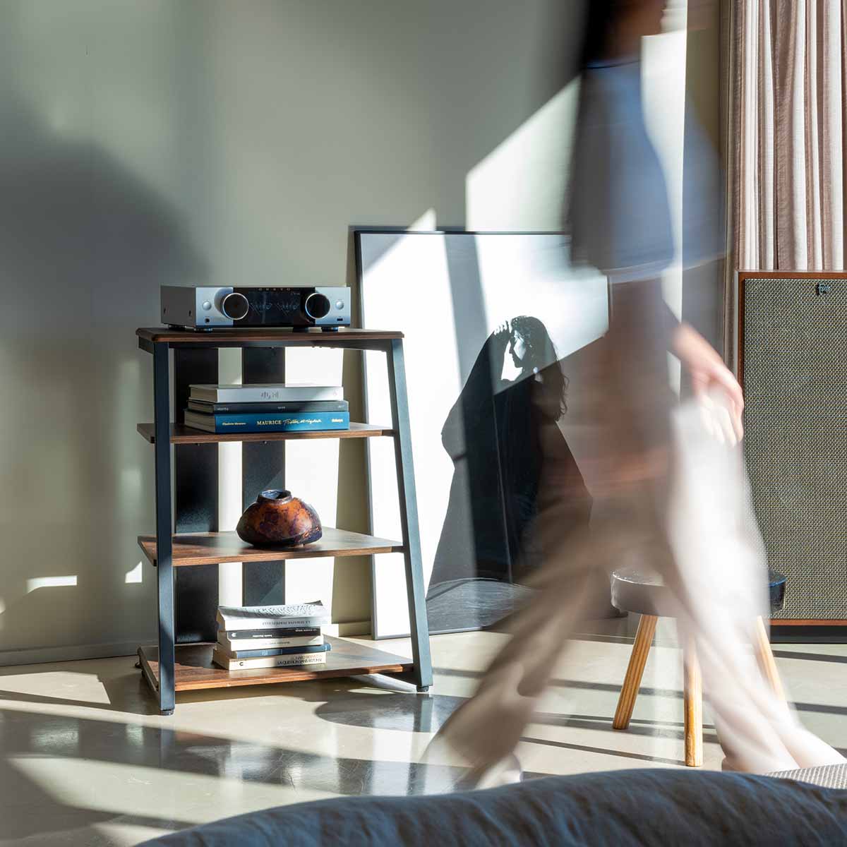Onkyo Muse Y-50 Network Integrated Amplifier - Silver - lifestyle view of unit on shelf to left with wallking woman in front