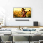 Sony BRAVIA Theater Bar 7 Soundbar + Sub 7 Wireless Subwoofer lifestyle photo of bar mounted under TV on wall with sub on floor to right