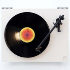 Rega Planar 1 Turntable - white - top down view with record on platter and tone arm engaged